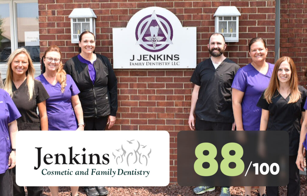 A smiling dentist team, Dr. Jenkins, standing confidently outside.