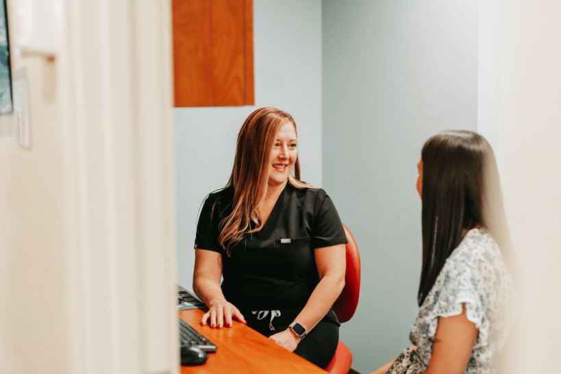 Caron and Jones Dentist discussing TMJ treatment options with patient.